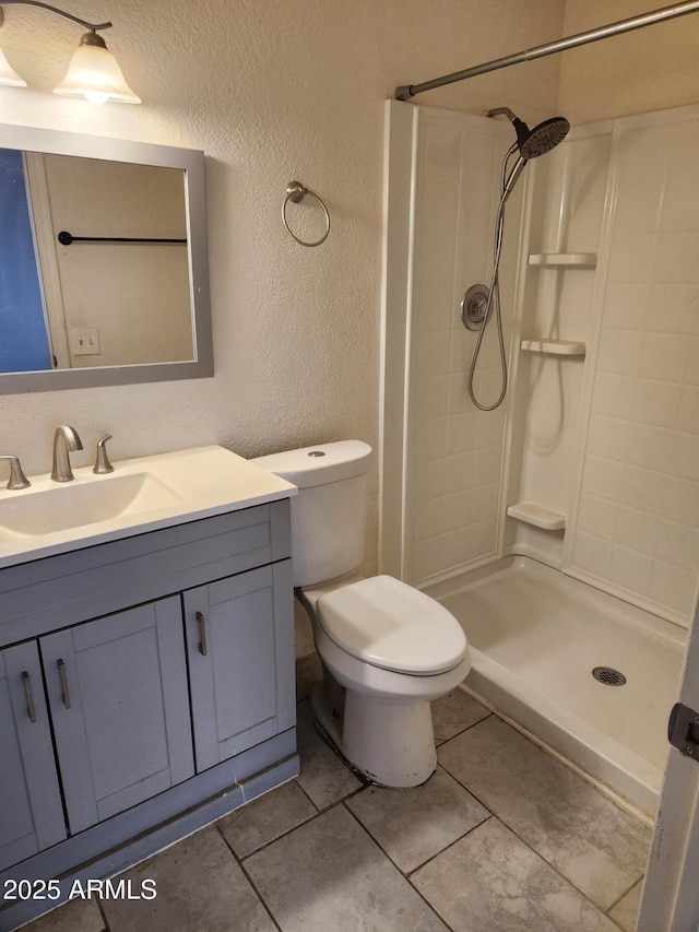 3329 W Ross Ave W, Phoenix, AZ 85027 - full bath with a textured wall, a stall shower, vanity, and tile patterned flooring
