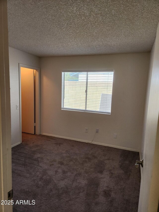 3329 W Ross Ave W, Phoenix, AZ 85027 - carpeted empty room with a textured ceiling and baseboards