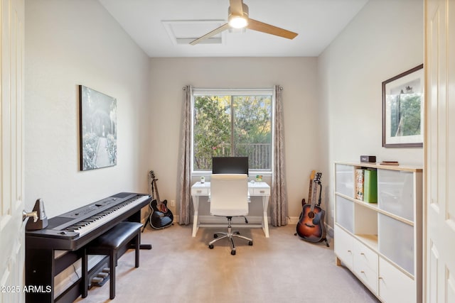 office area with light carpet and a ceiling fan