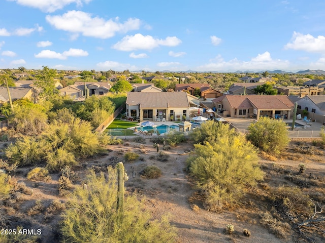 aerial perspective of suburban area featuring a pool