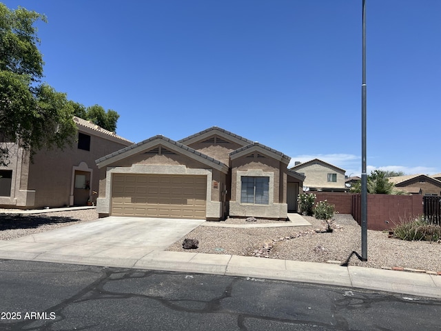13004 W Saint Moritz Ln, El Mirage, AZ 85335 - view of front of property featuring a garage, stucco siding, concrete driveway, and a tile roof