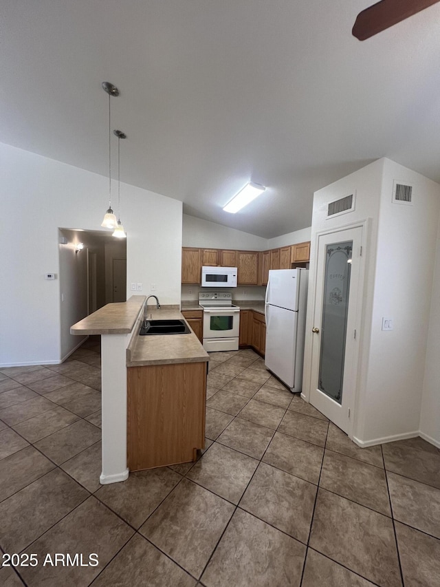 13004 W Saint Moritz Ln, El Mirage, AZ 85335 - kitchen with white appliances, a peninsula, light countertops, lofted ceiling, and light tile patterned floors