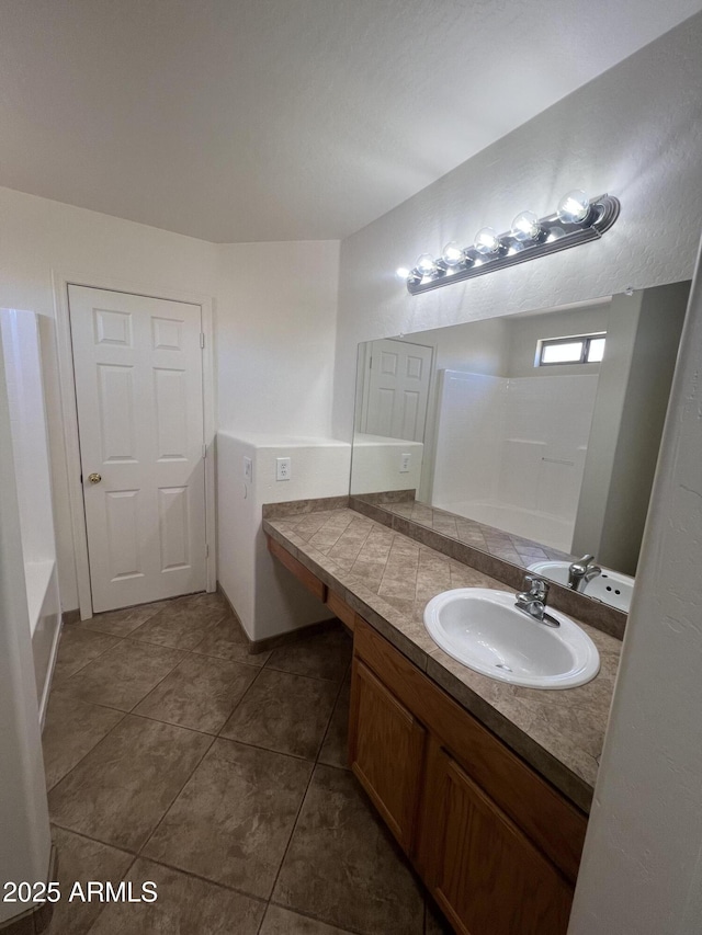 13004 W Saint Moritz Ln, El Mirage, AZ 85335 - bathroom with vanity, a bathtub, tile patterned flooring, and a shower