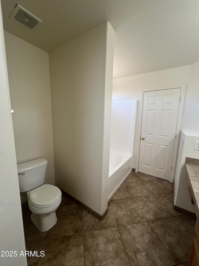 13004 W Saint Moritz Ln, El Mirage, AZ 85335 - bathroom with a tub to relax in, tile patterned flooring, and vanity