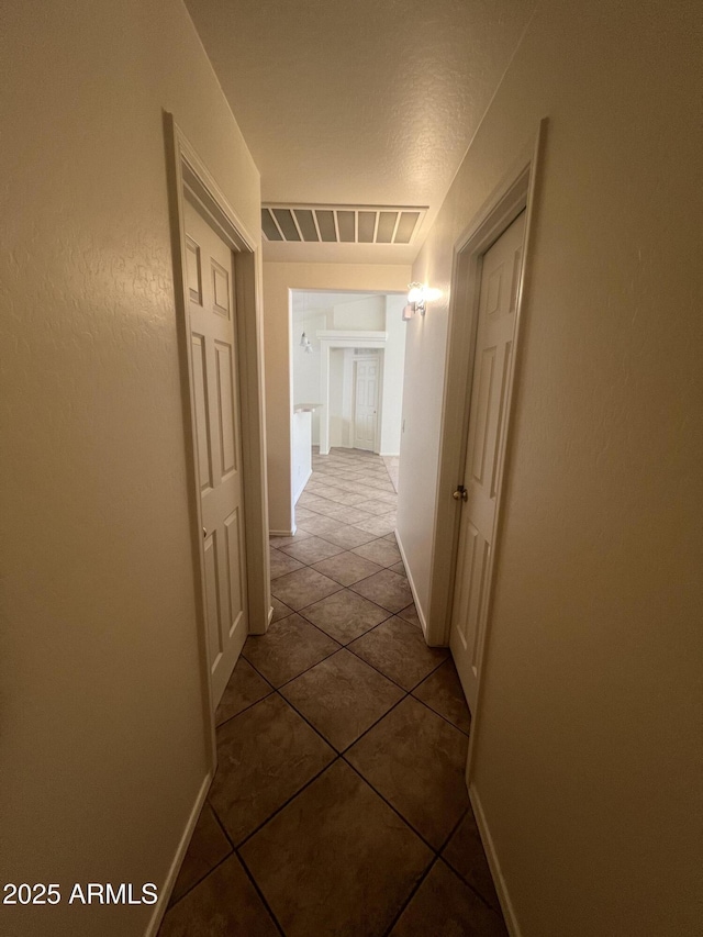 13004 W Saint Moritz Ln, El Mirage, AZ 85335 - hall with tile patterned flooring and baseboards