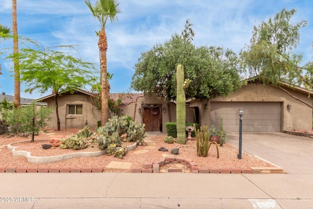 7210 N 17th Ave, Phoenix, AZ 85021 - view of front of property featuring concrete driveway, stucco siding, and an attached garage