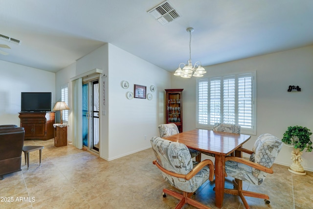 dining space featuring a notable chandelier, baseboards, and visible vents