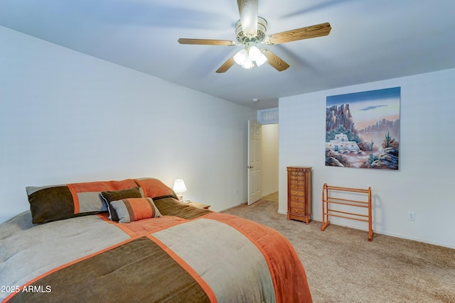 bedroom with ceiling fan and carpet