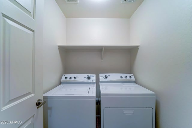 laundry room featuring laundry area, washer and dryer, and visible vents