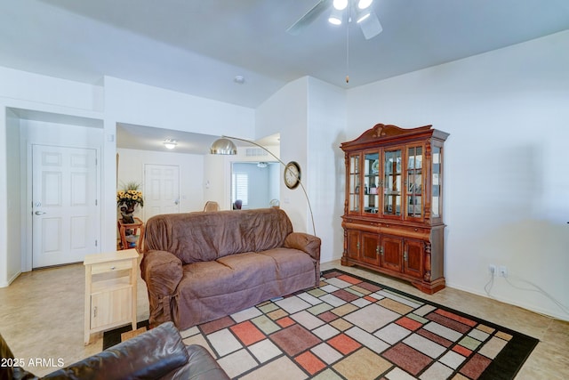 living room featuring a ceiling fan and vaulted ceiling