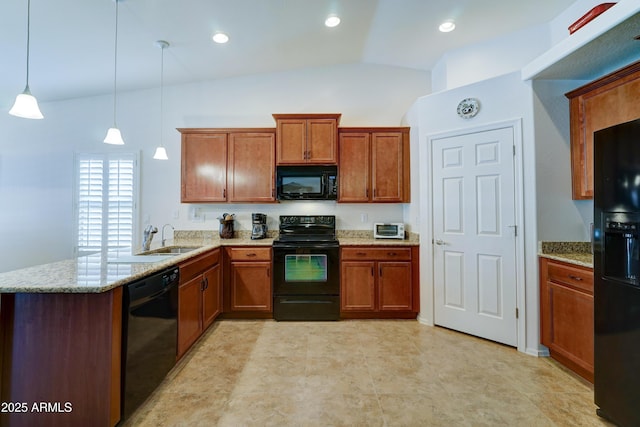 kitchen with brown cabinetry, a peninsula, black appliances, and light stone counters