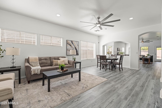 4140 E Claxton Ave, Gilbert, AZ 85297 - living area featuring a ceiling fan, arched walkways, recessed lighting, wood finished floors, and baseboards