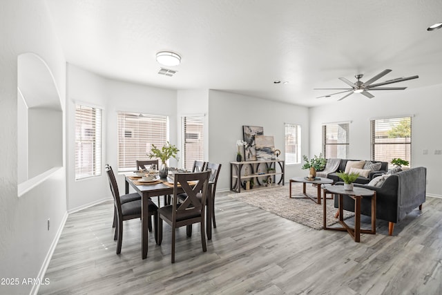 4140 E Claxton Ave, Gilbert, AZ 85297 - dining area featuring light wood-type flooring, baseboards, and ceiling fan