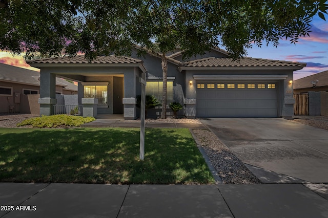 4140 E Claxton Ave, Gilbert, AZ 85297 - view of front of home featuring an attached garage, stucco siding, a tiled roof, and concrete driveway