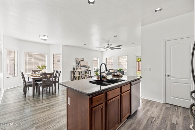 4140 E Claxton Ave, Gilbert, AZ 85297 - kitchen with a sink, stainless steel dishwasher, light wood finished floors, a kitchen island with sink, and recessed lighting