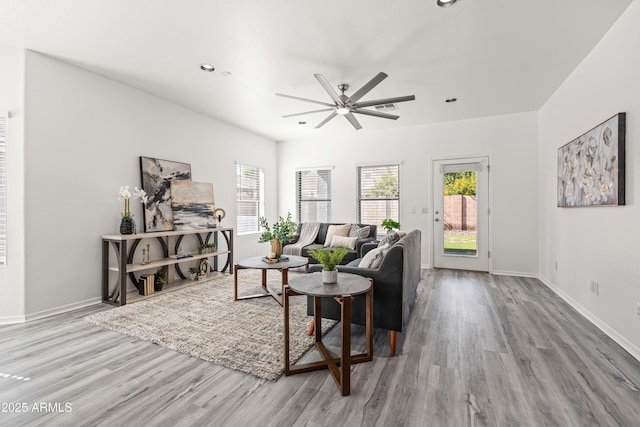 4140 E Claxton Ave, Gilbert, AZ 85297 - living area with wood finished floors, a ceiling fan, plenty of natural light, and recessed lighting