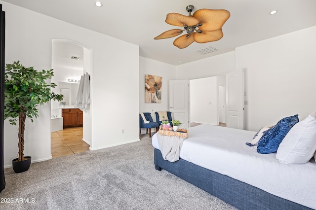 4140 E Claxton Ave, Gilbert, AZ 85297 - carpeted bedroom with arched walkways, ensuite bath, recessed lighting, baseboards, and ceiling fan