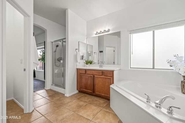 4140 E Claxton Ave, Gilbert, AZ 85297 - full bath featuring vanity, a garden tub, a stall shower, and tile patterned flooring