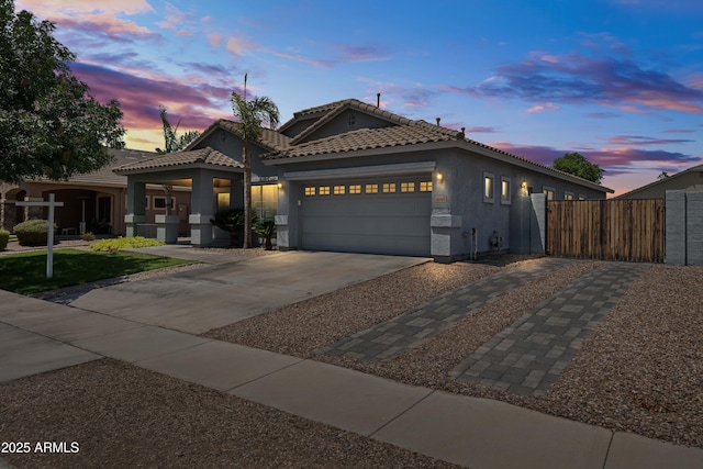 4140 E Claxton Ave, Gilbert, AZ 85297 - view of front of property featuring a garage, stucco siding, a tiled roof, and driveway