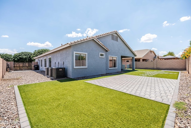 4140 E Claxton Ave, Gilbert, AZ 85297 - rear view of property featuring central AC unit, stucco siding, and a patio area
