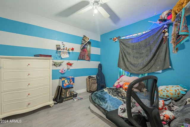 bedroom featuring ceiling fan and light hardwood / wood-style flooring