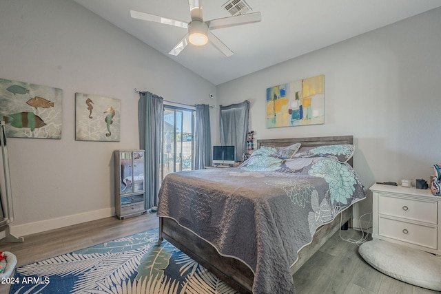 bedroom featuring ceiling fan, wood-type flooring, and vaulted ceiling