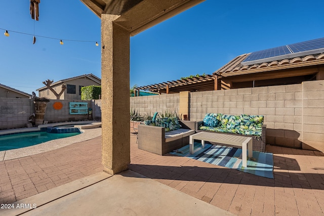 view of patio with a swimming pool with hot tub