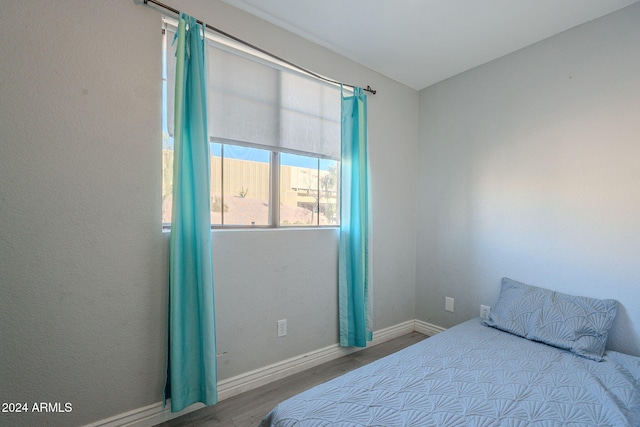 bedroom featuring hardwood / wood-style floors