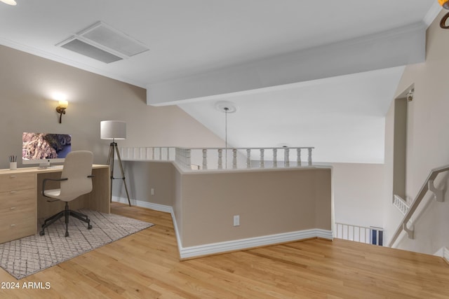 home office with crown molding and light wood-type flooring