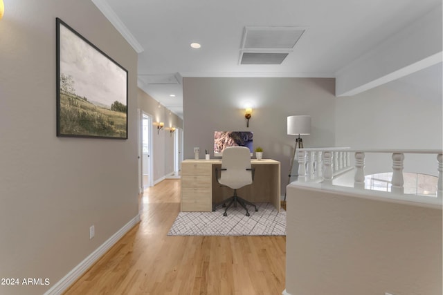 home office featuring crown molding and light wood-type flooring