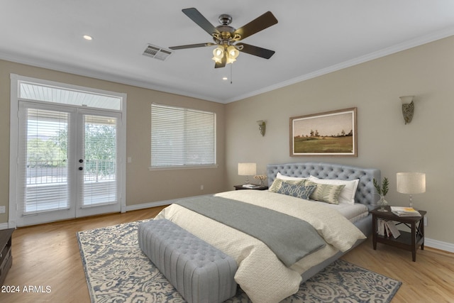 bedroom featuring crown molding, ceiling fan, access to exterior, light hardwood / wood-style floors, and french doors