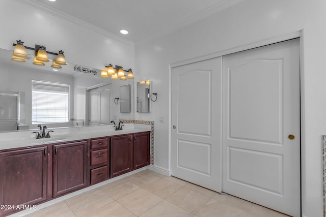 bathroom with ornamental molding, tile patterned flooring, and vanity