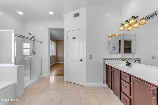 bathroom featuring crown molding, vanity, separate shower and tub, and tile patterned flooring