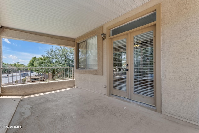 view of patio featuring french doors and a balcony