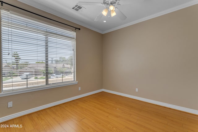 unfurnished room with crown molding, ceiling fan, and light hardwood / wood-style floors