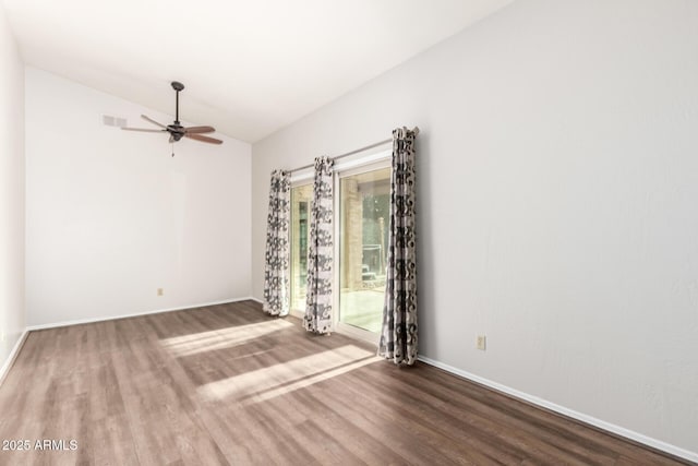 16638 N 46th Ln, Glendale, AZ 85306 - empty room featuring visible vents, baseboards, wood finished floors, and vaulted ceiling