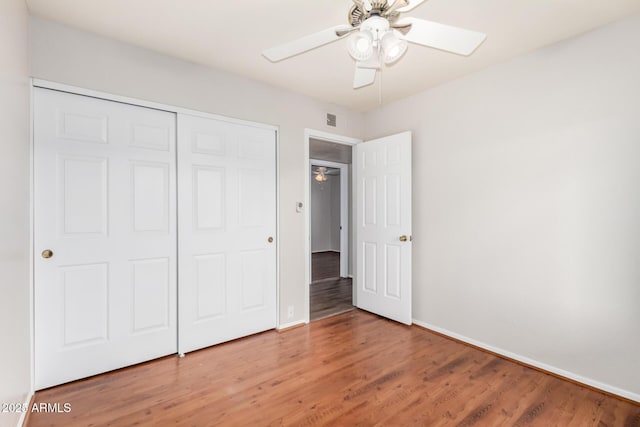 16638 N 46th Ln, Glendale, AZ 85306 - unfurnished bedroom featuring light wood-style flooring, a closet, baseboards, and visible vents