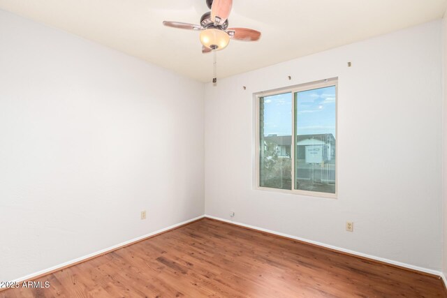 16638 N 46th Ln, Glendale, AZ 85306 - empty room with wood finished floors, baseboards, and a ceiling fan