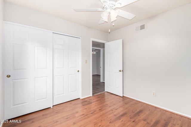 16638 N 46th Ln, Glendale, AZ 85306 - unfurnished bedroom with a closet, visible vents, baseboards, and light wood-style flooring