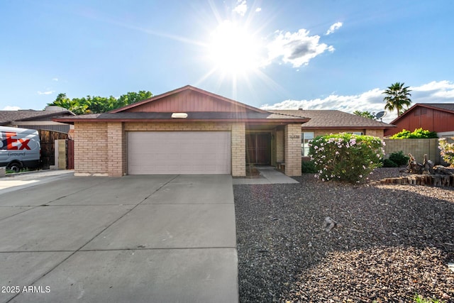 16638 N 46th Ln, Glendale, AZ 85306 - ranch-style home featuring an attached garage, driveway, fence, and brick siding