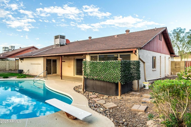 16638 N 46th Ln, Glendale, AZ 85306 - rear view of house with a shingled roof, a fenced backyard, a fenced in pool, and a patio area