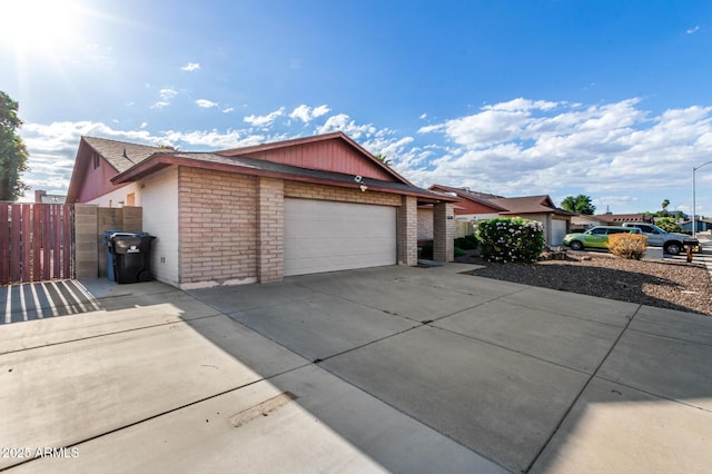 16638 N 46th Ln, Glendale, AZ 85306 - ranch-style home with concrete driveway, brick siding, fence, and an attached garage