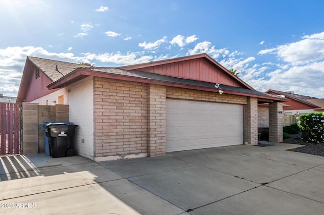 16638 N 46th Ln, Glendale, AZ 85306 - view of property exterior with concrete driveway, fence, and brick siding