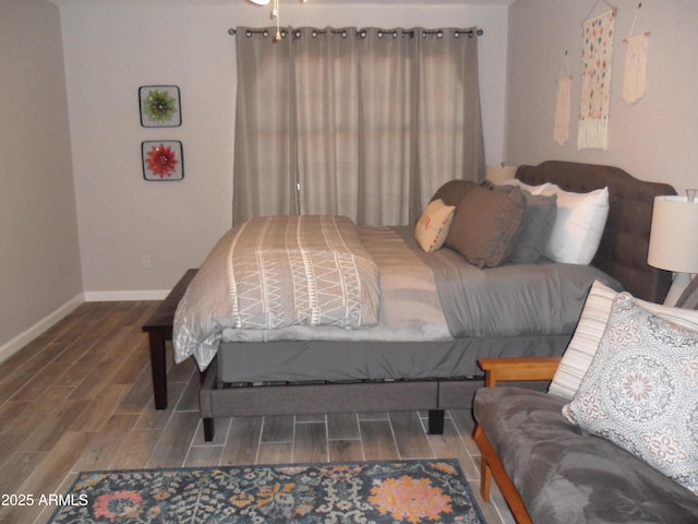 1333 N Higley Rd Unit 7, Mesa, AZ 85205 - bedroom featuring baseboards and wood finished floors