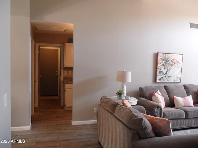 1333 N Higley Rd Unit 7, Mesa, AZ 85205 - living area featuring wood finished floors, attic access, and baseboards