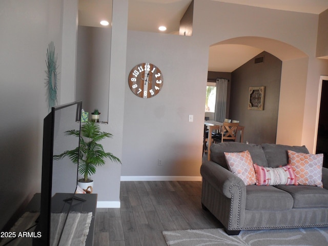 1333 N Higley Rd Unit 7, Mesa, AZ 85205 - living area with arched walkways, wood finished floors, baseboards, and vaulted ceiling