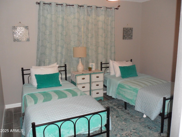 1333 N Higley Rd Unit 7, Mesa, AZ 85205 - bedroom featuring dark wood-style flooring and baseboards