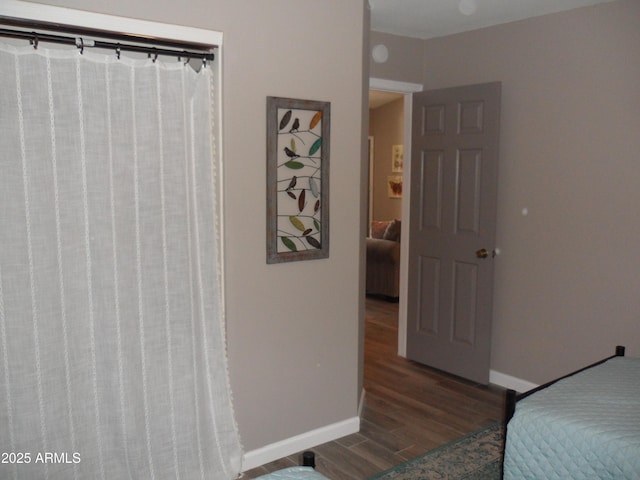 1333 N Higley Rd Unit 7, Mesa, AZ 85205 - bedroom featuring wood finished floors and baseboards