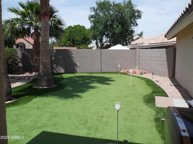 1333 N Higley Rd Unit 7, Mesa, AZ 85205 - fenced backyard with a putting area