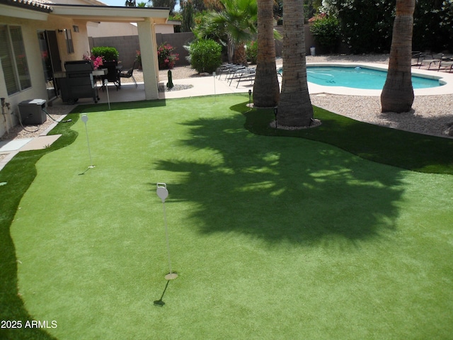 1333 N Higley Rd Unit 7, Mesa, AZ 85205 - view of yard with an area to practice putting and a patio area